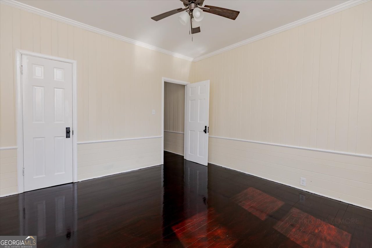 1205 Swift Street Perry, GA 31069 - Photo 47 of 63 wooden floor in an empty room with a window