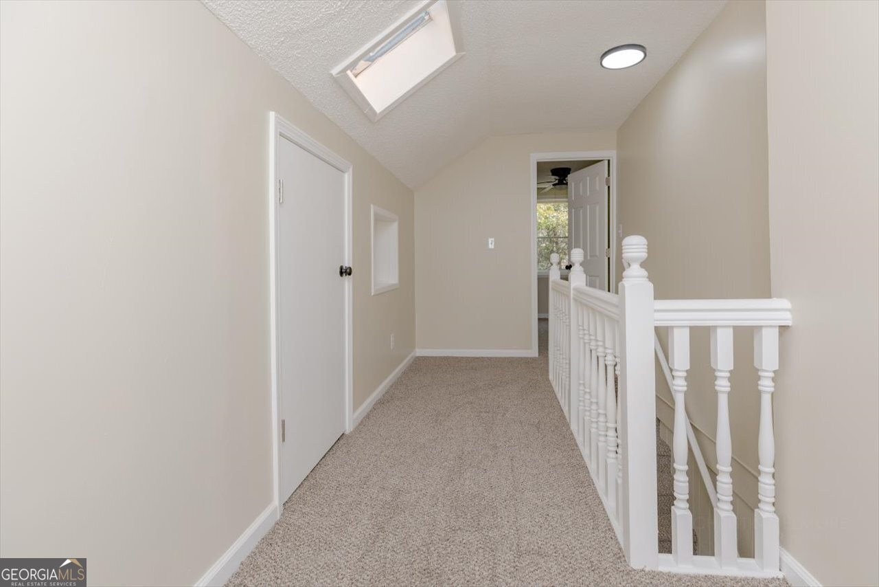 1205 Swift Street Perry, GA 31069 - Photo 49 of 63 a view of a hallway with a white walls