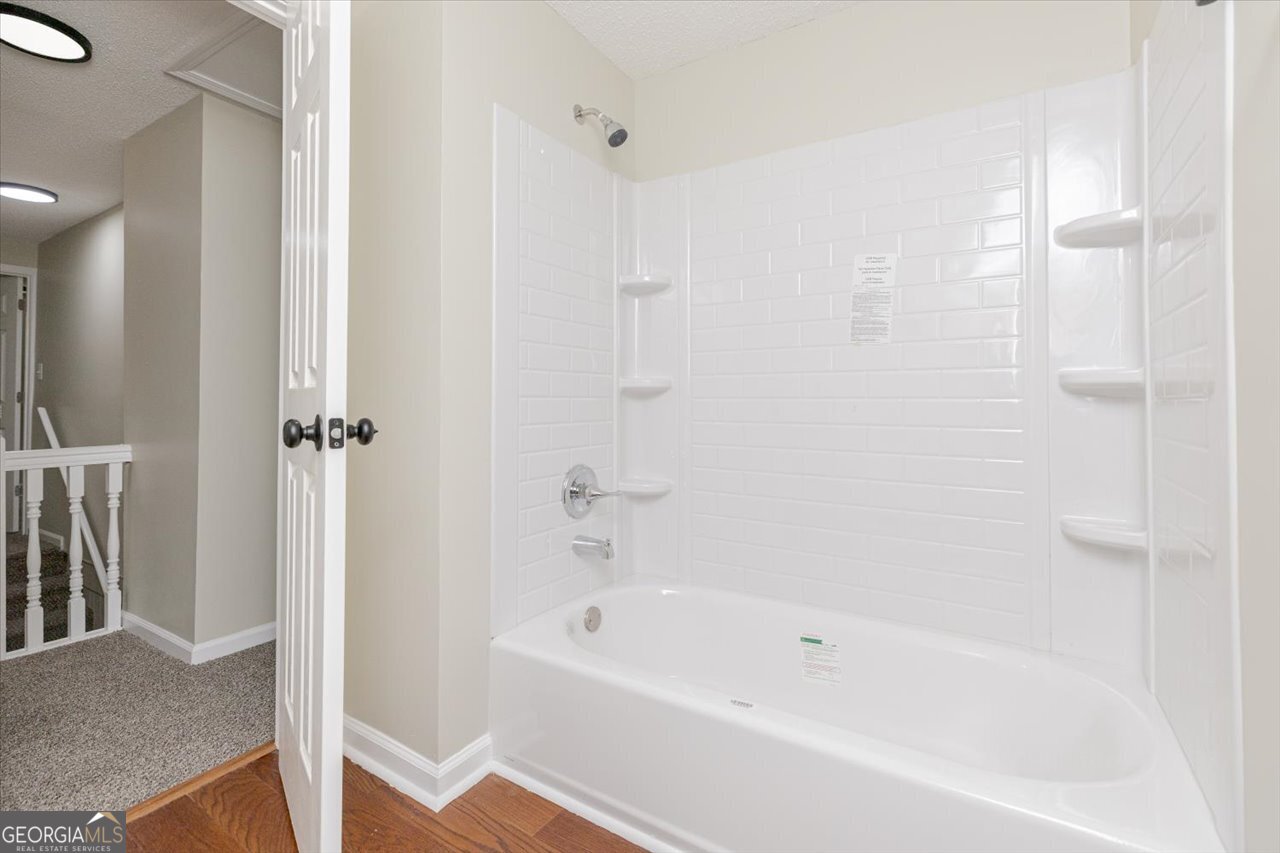 1205 Swift Street Perry, GA 31069 - Photo 55 of 63 a white bath tub sitting next to a shower