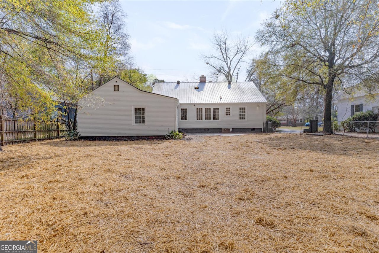 1205 Swift Street Perry, GA 31069 - Photo 56 of 63 a white house that has a tree in front of it