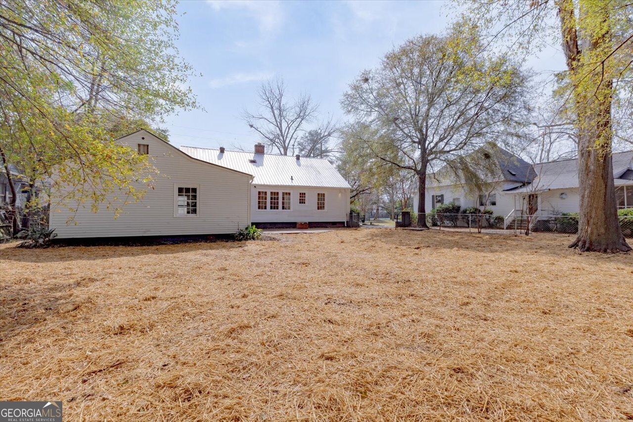 1205 Swift Street Perry, GA 31069 - Photo 57 of 63 a front view of house with large trees