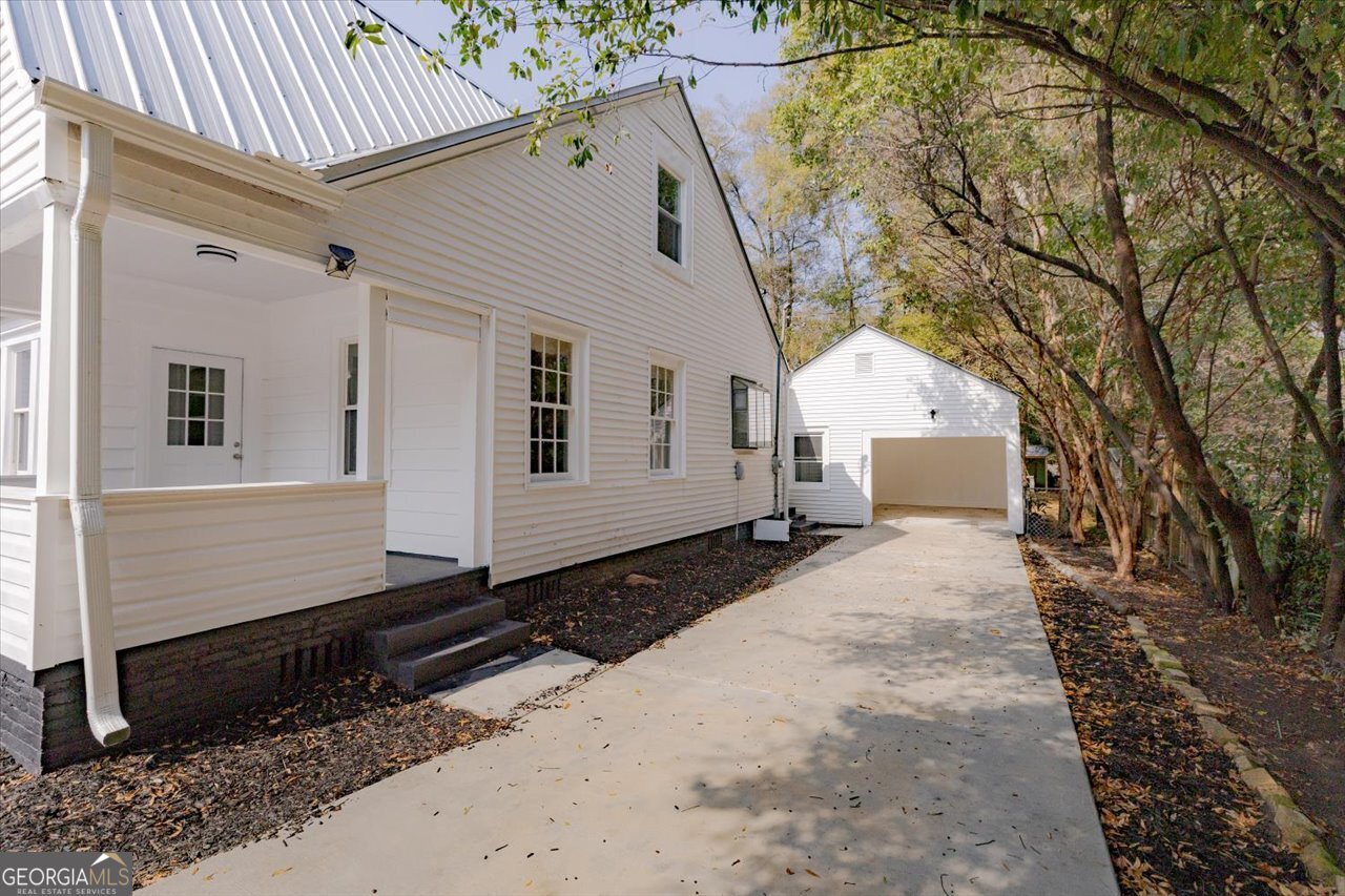 1205 Swift Street Perry, GA 31069 - Photo 6 of 63 a front view of a house with a yard