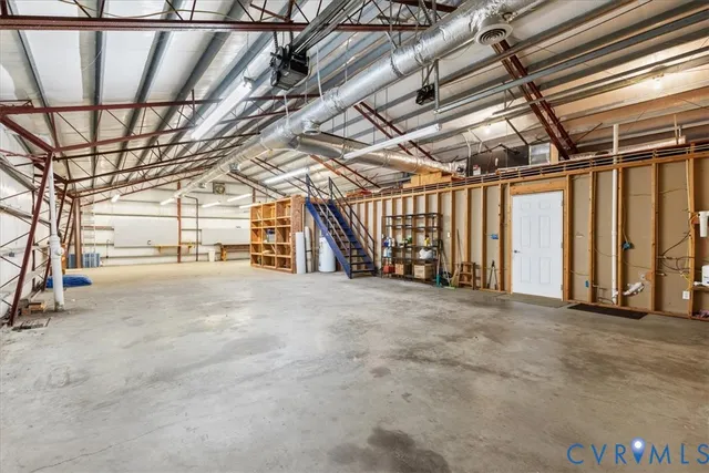 a view of empty room with wooden walls