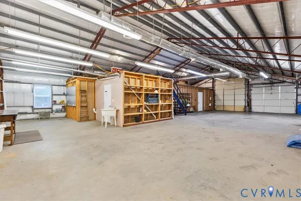 a view of an empty room with wooden roof