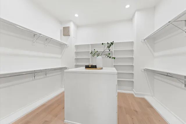 a bathroom with a sink vanity and a mirror
