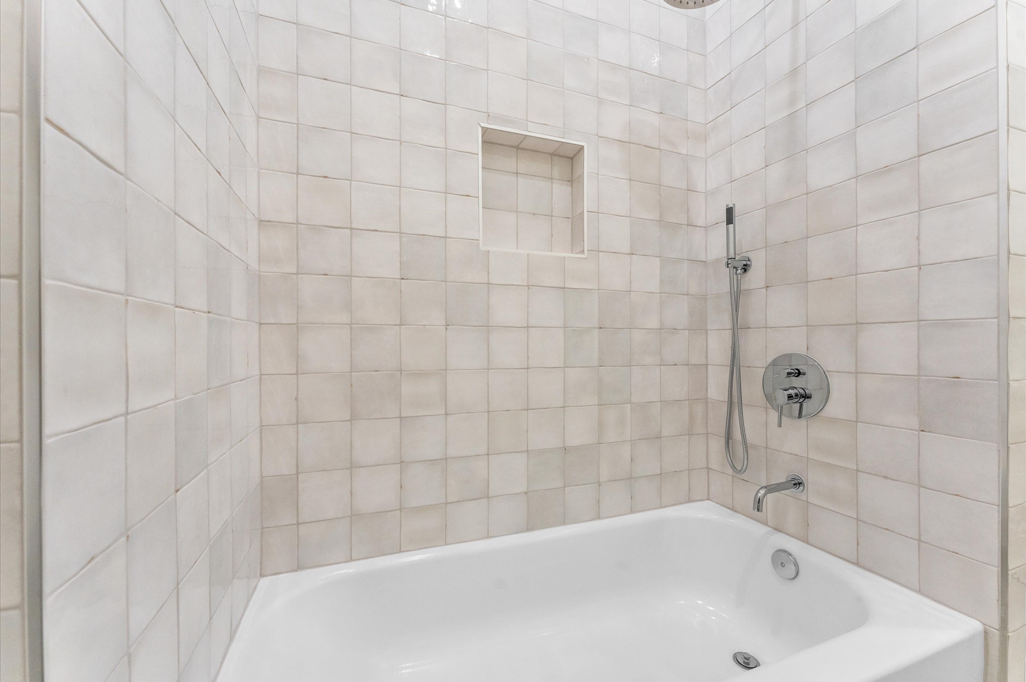 4403 Feagan Street Houston, TX 77007 - Photo 35 of 40 a bathroom with a white bath tub and a shower