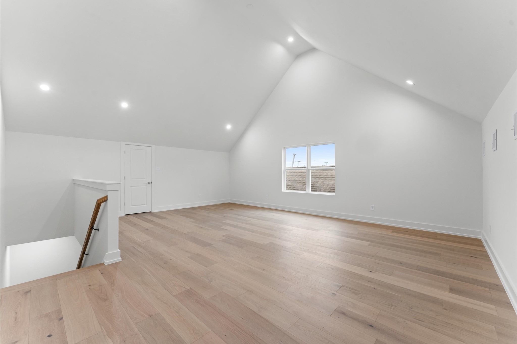 4403 Feagan Street Houston, TX 77007 - Photo 38 of 40 an empty room with wooden floor and window