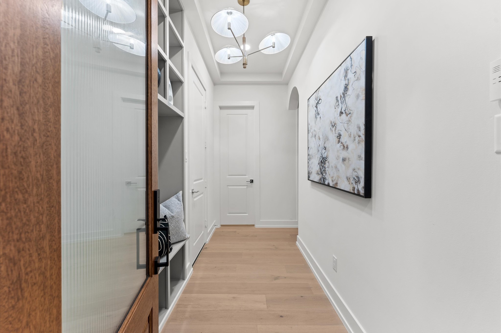 4403 Feagan Street Houston, TX 77007 - Photo 6 of 40 a view of a hallway with wooden floor and a potted plant