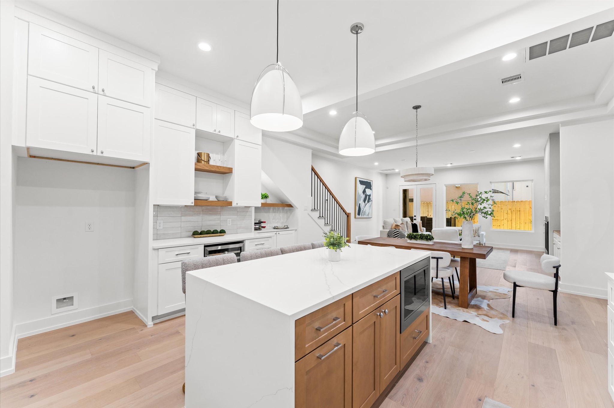 4403 Feagan Street Houston, TX 77007 - Photo 9 of 40 a kitchen with a stove a refrigerator a sink and chairs
