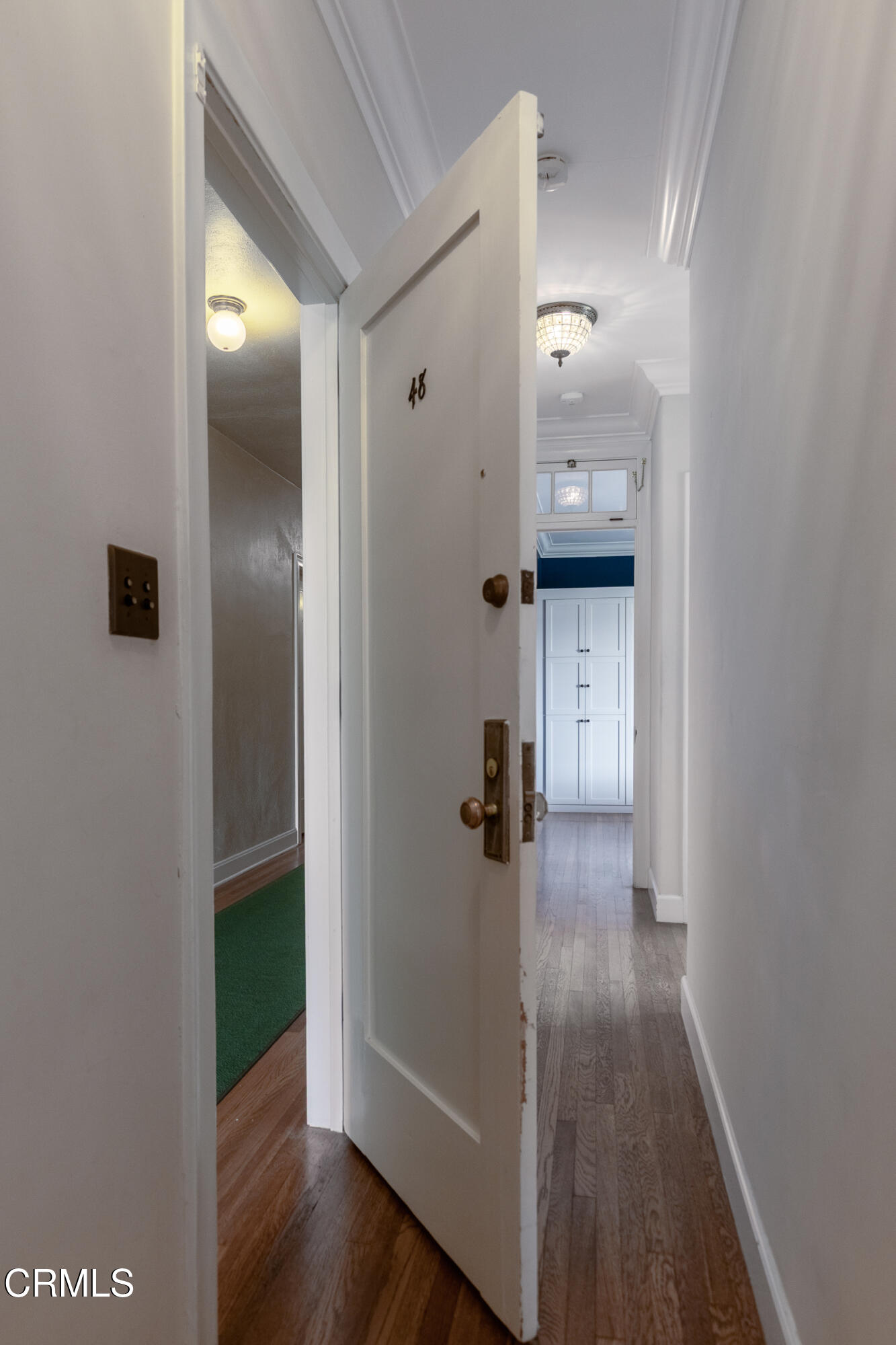 85 North Madison Avenue, Unit 48 Pasadena, CA 91101 - Photo 25 of 31 a view of a hallway with wooden floor