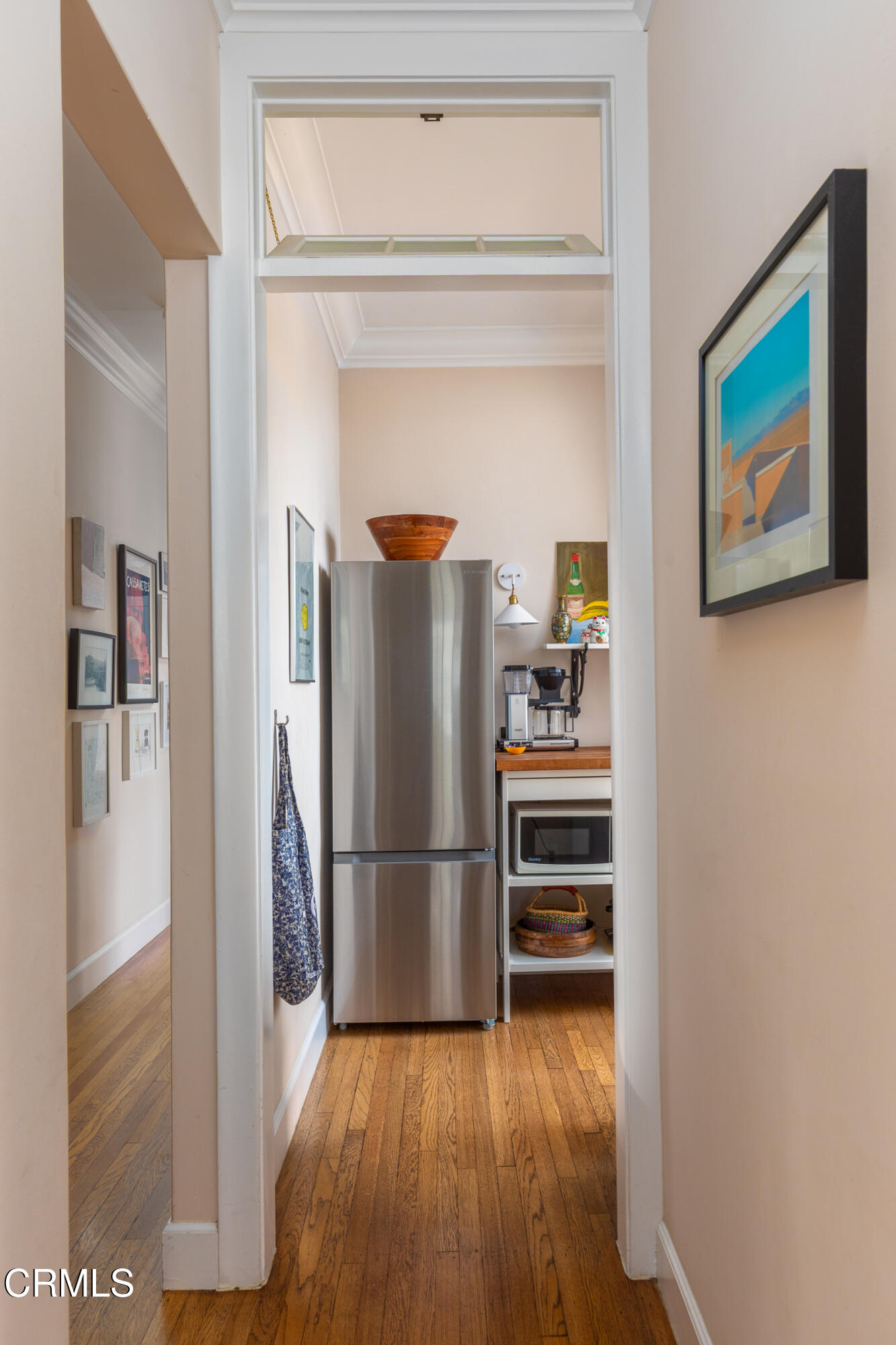 85 North Madison Avenue, Unit 48 Pasadena, CA 91101 - Photo 9 of 31 a kitchen with wooden floors and a refrigerator