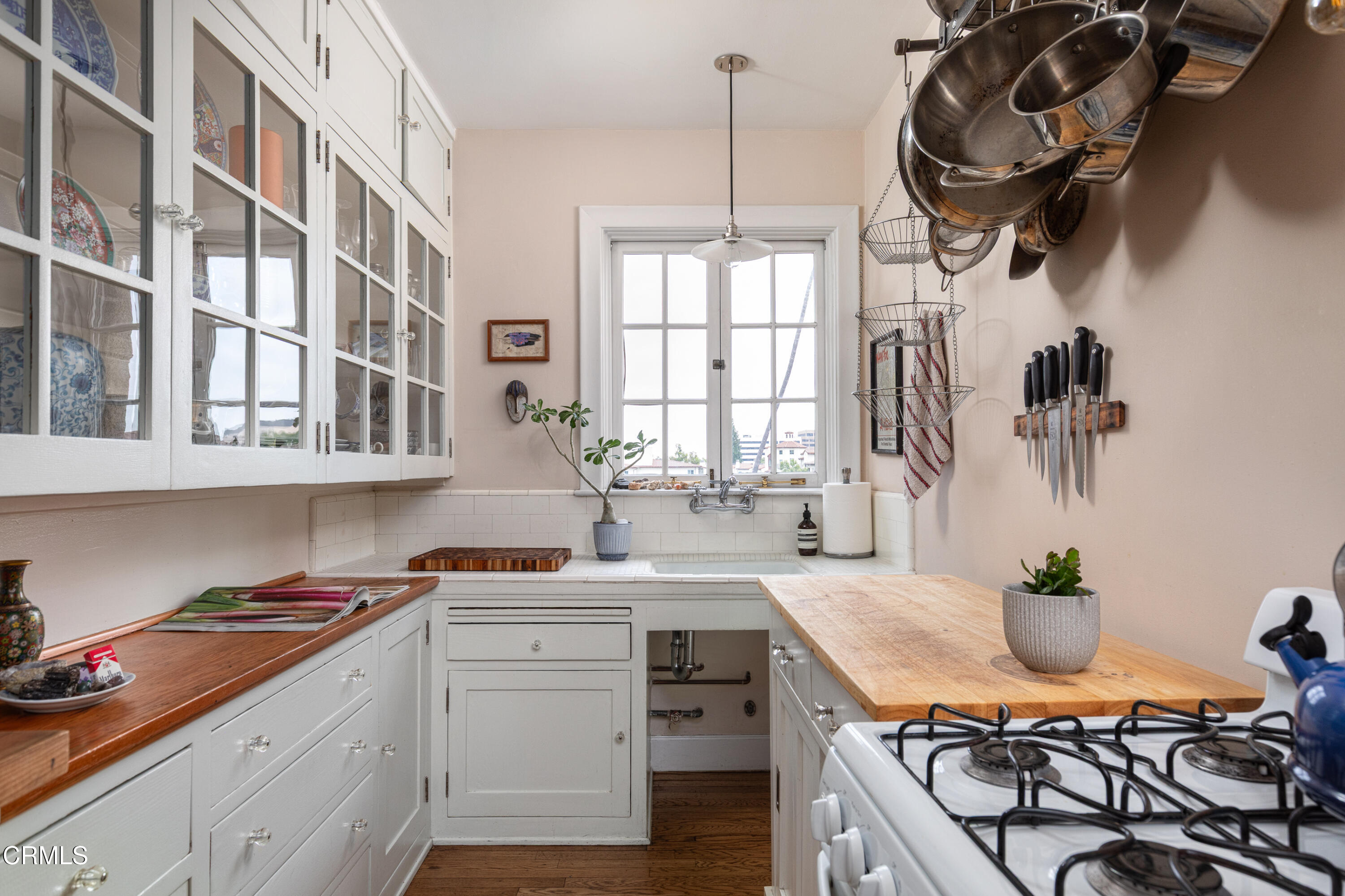 85 North Madison Avenue, Unit 48 Pasadena, CA 91101 - Photo 10 of 31 a kitchen with stainless steel appliances granite countertop a sink a stove and a wooden floors