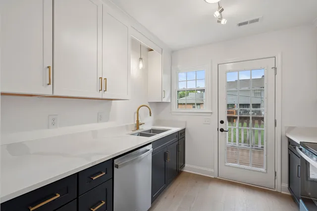 a kitchen with a sink and cabinets