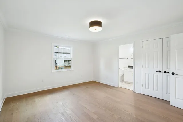 an empty room with a empty space and a window