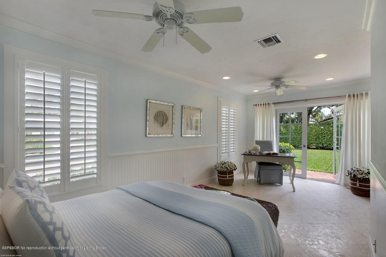 11 Ridge Boulevard Ocean Ridge, FL 33435 - Photo 21 of 26 a bedroom with a bed and a couch
