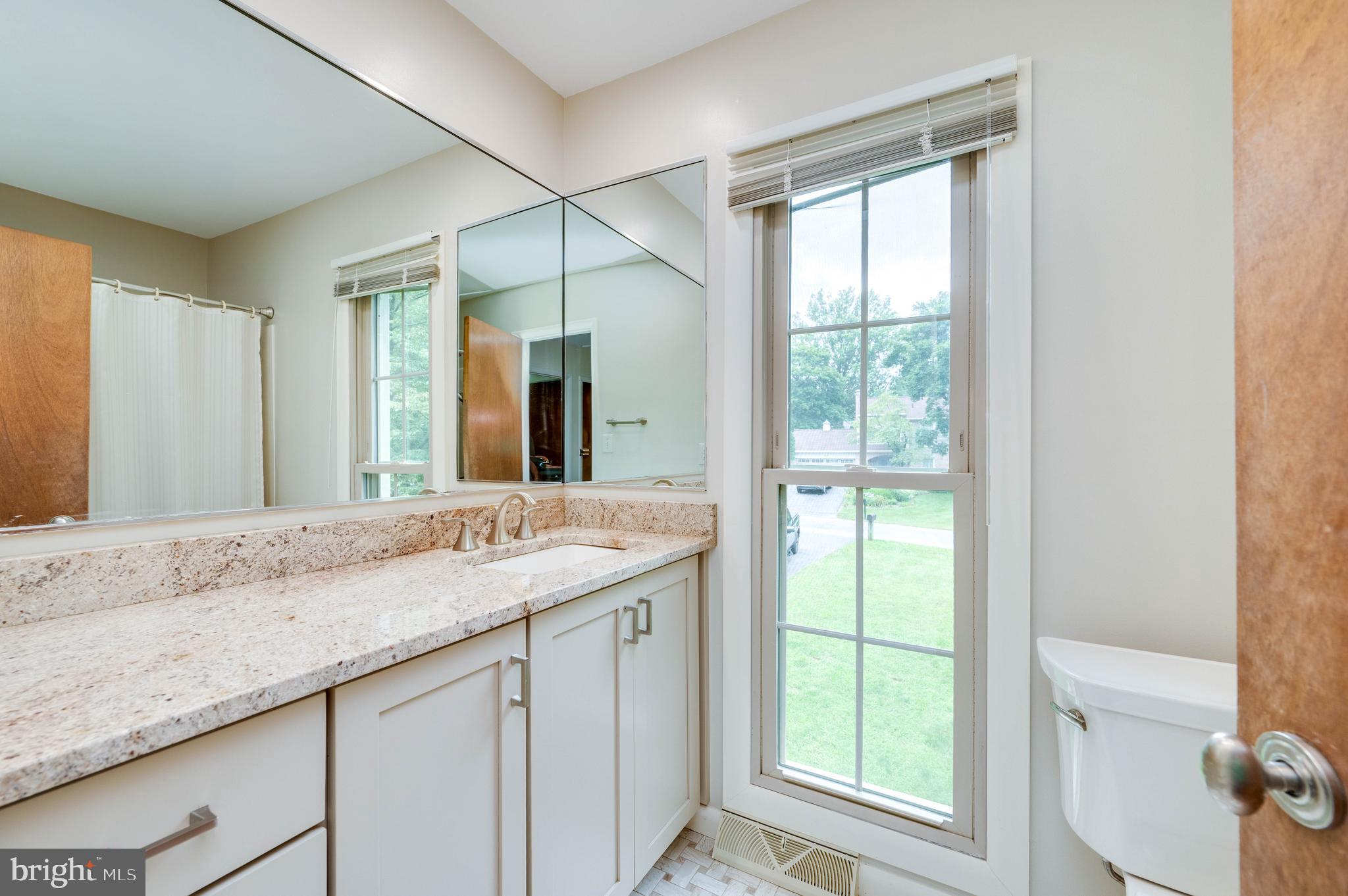 4 Nassau Circle Reading, PA 19607 - Photo 15 of 23 a bathroom with a granite countertop sink and a mirror