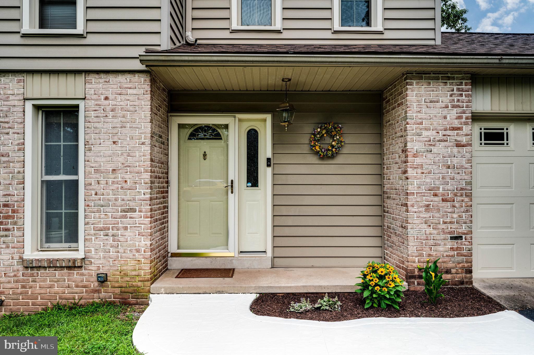 4 Nassau Circle Reading, PA 19607 - Photo 2 of 23 a front view of a house with plants