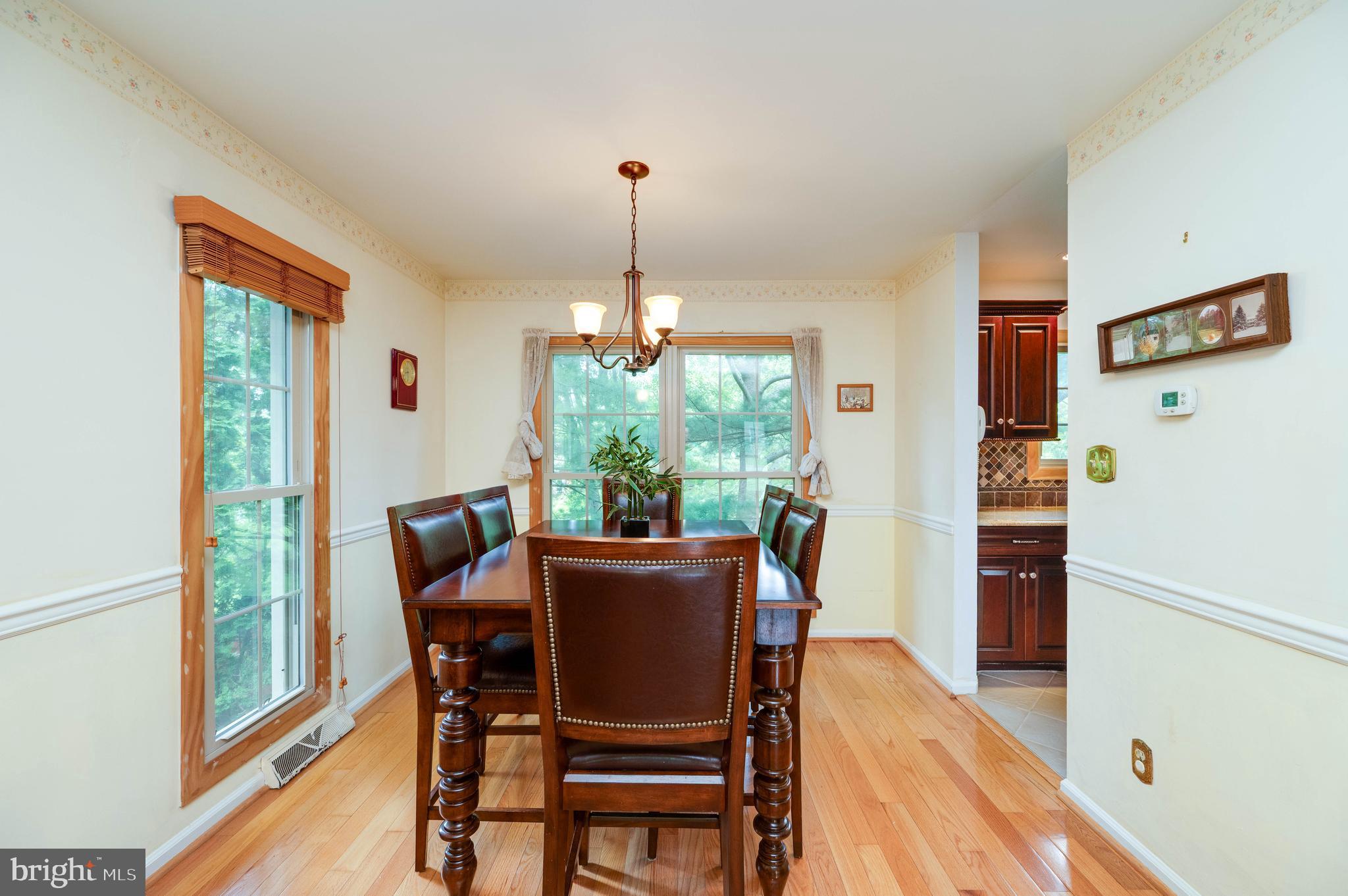 4 Nassau Circle Reading, PA 19607 - Photo 8 of 23 a dining room with furniture window wooden floor and a chandelier