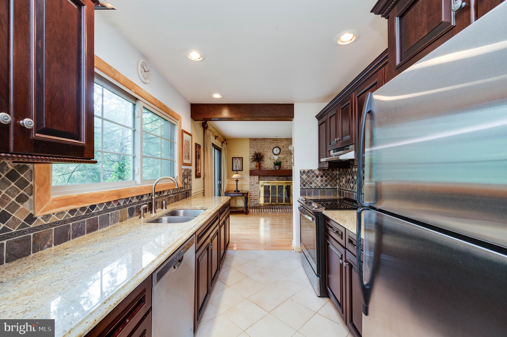 4 Nassau Circle Reading, PA 19607 - Photo 9 of 23 a kitchen with stainless steel appliances granite countertop sink stove and refrigerator
