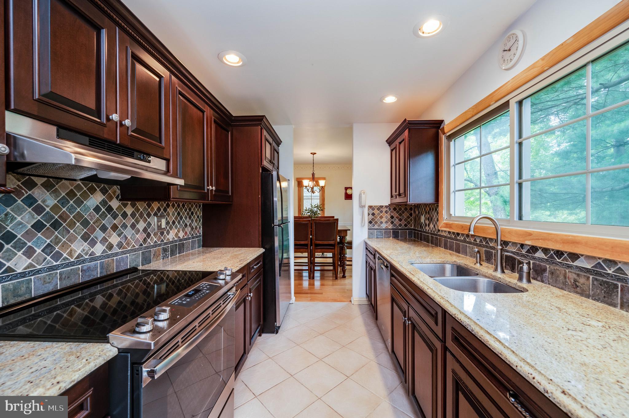 4 Nassau Circle Reading, PA 19607 - Photo 10 of 23 a kitchen with stainless steel appliances granite countertop a sink stove and cabinets