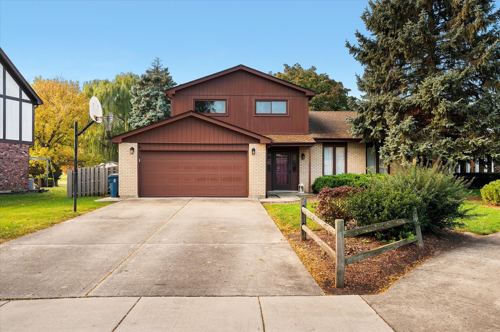 1228 Honey Hill Road Addison, IL 60101 - Photo 1 of 41 a front view of a house with a garden and plants
