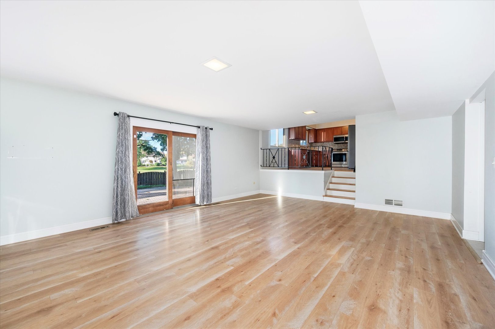 1228 Honey Hill Road Addison, IL 60101 - Photo 18 of 41 a view of a room with wooden floor and window