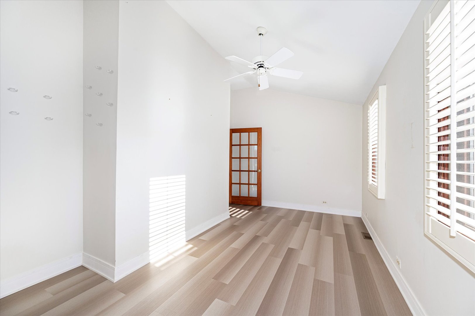 1228 Honey Hill Road Addison, IL 60101 - Photo 20 of 41 wooden floor in an empty room with a window