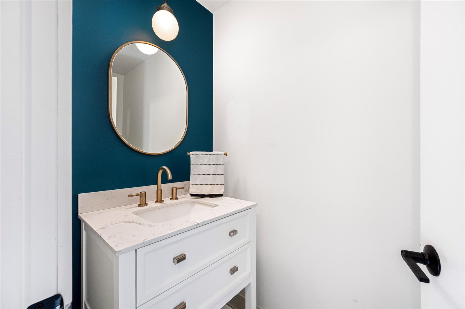 1228 Honey Hill Road Addison, IL 60101 - Photo 21 of 41 a bathroom with a sink and a mirror