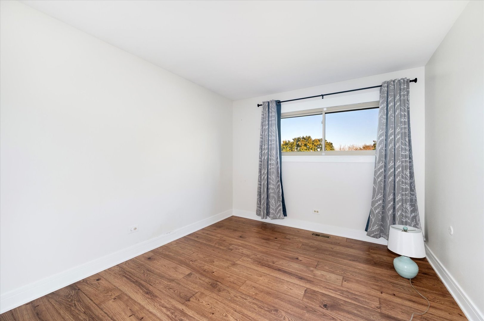 1228 Honey Hill Road Addison, IL 60101 - Photo 23 of 41 a view of empty room with wooden floor