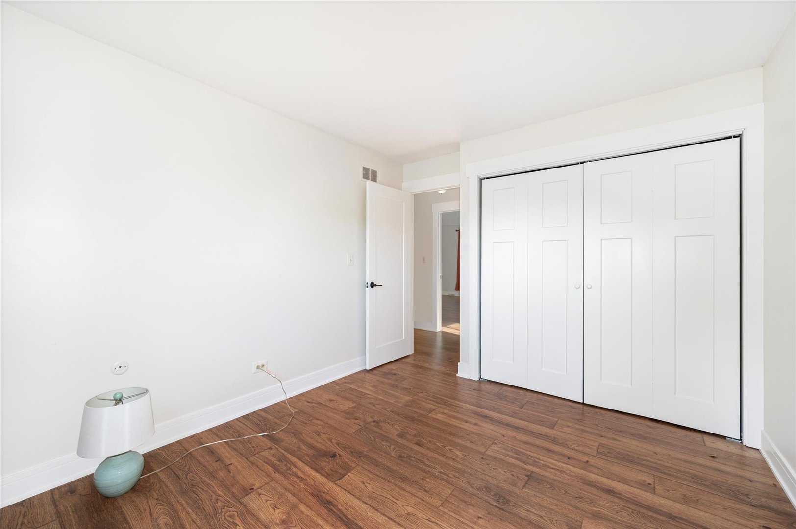 1228 Honey Hill Road Addison, IL 60101 - Photo 24 of 41 a view of a room with wooden floor