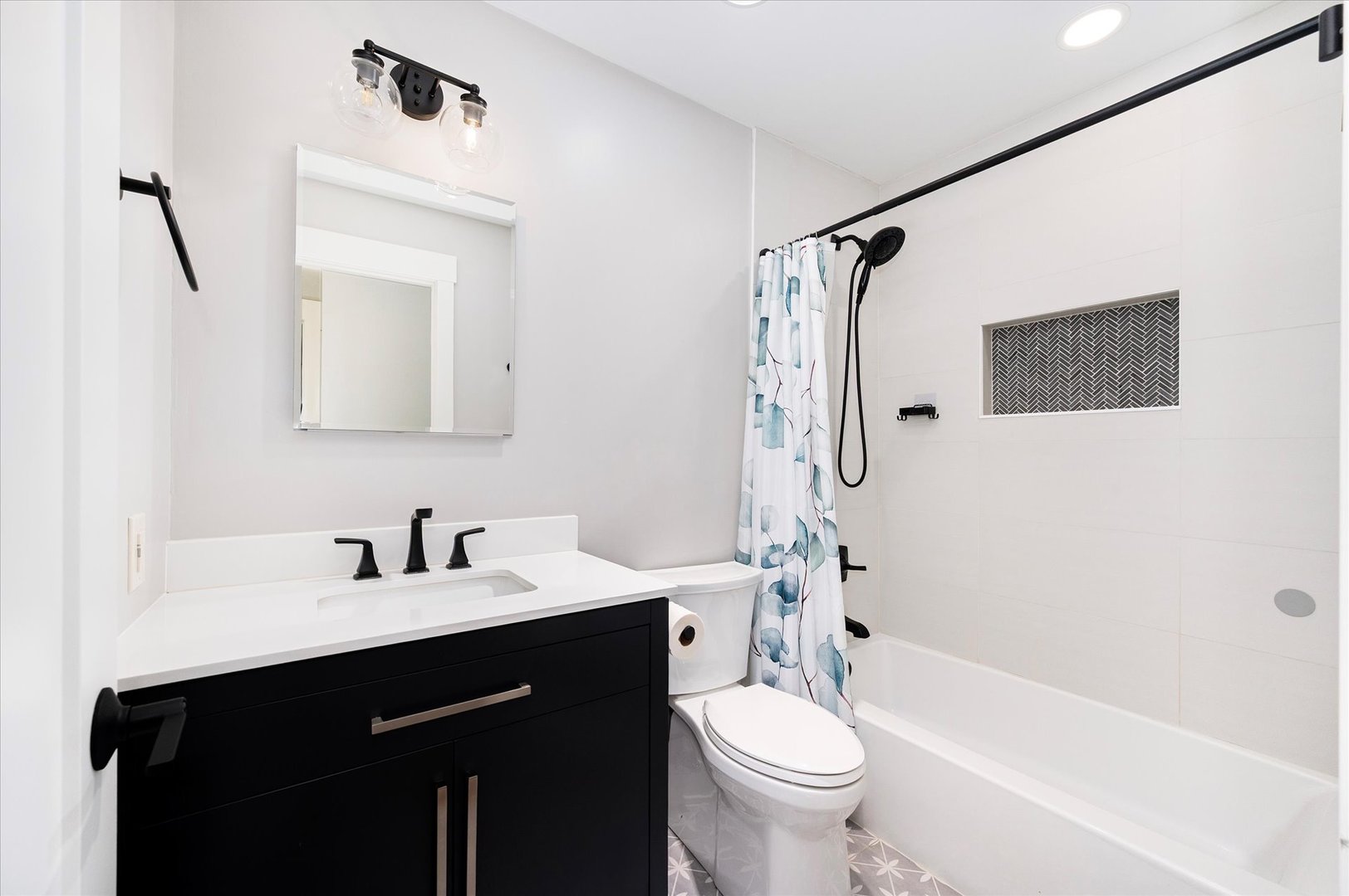 1228 Honey Hill Road Addison, IL 60101 - Photo 32 of 41 a bathroom with a sink a toilet and shower