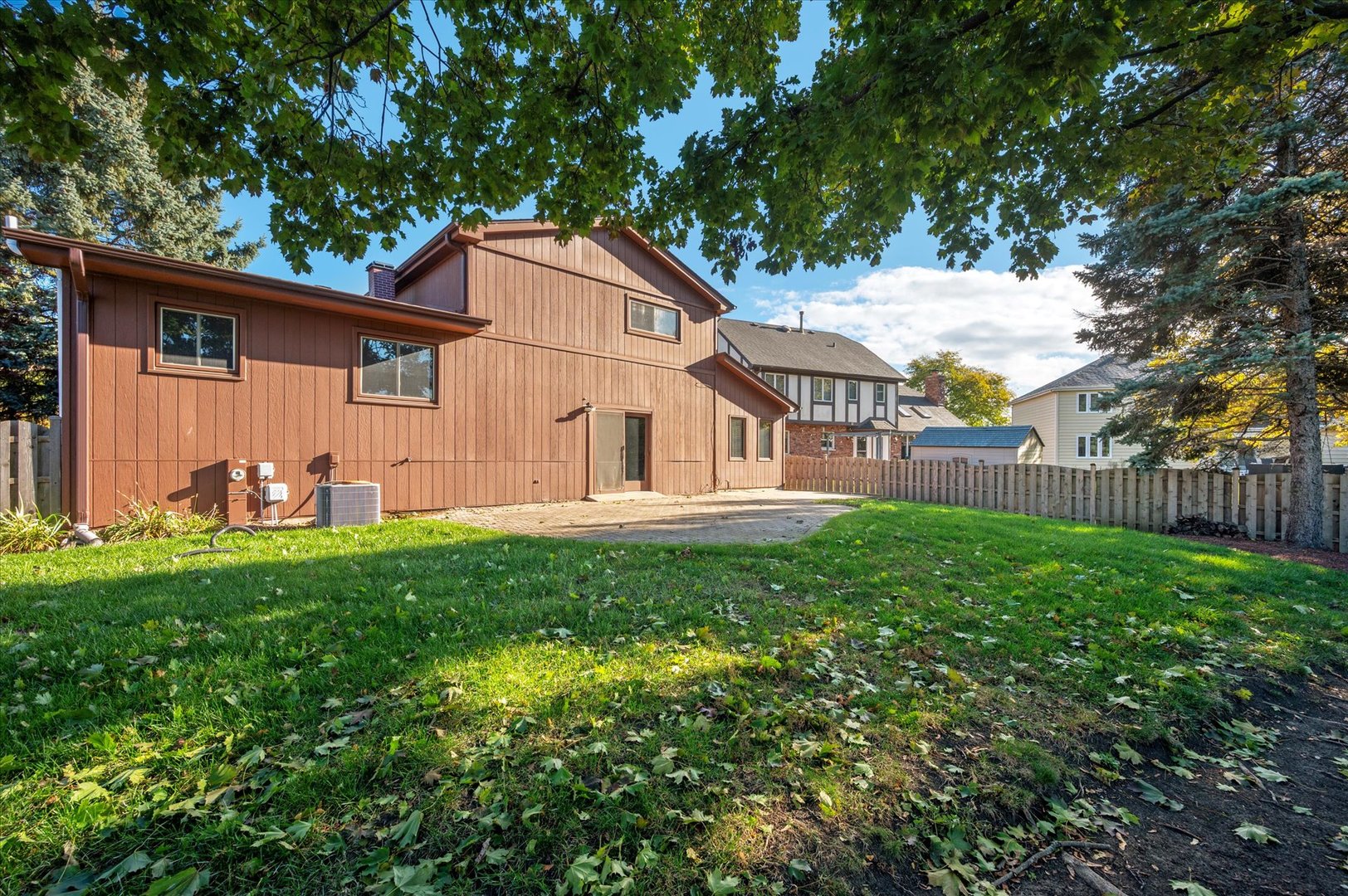 1228 Honey Hill Road Addison, IL 60101 - Photo 34 of 41 a view of a backyard with plants and large trees