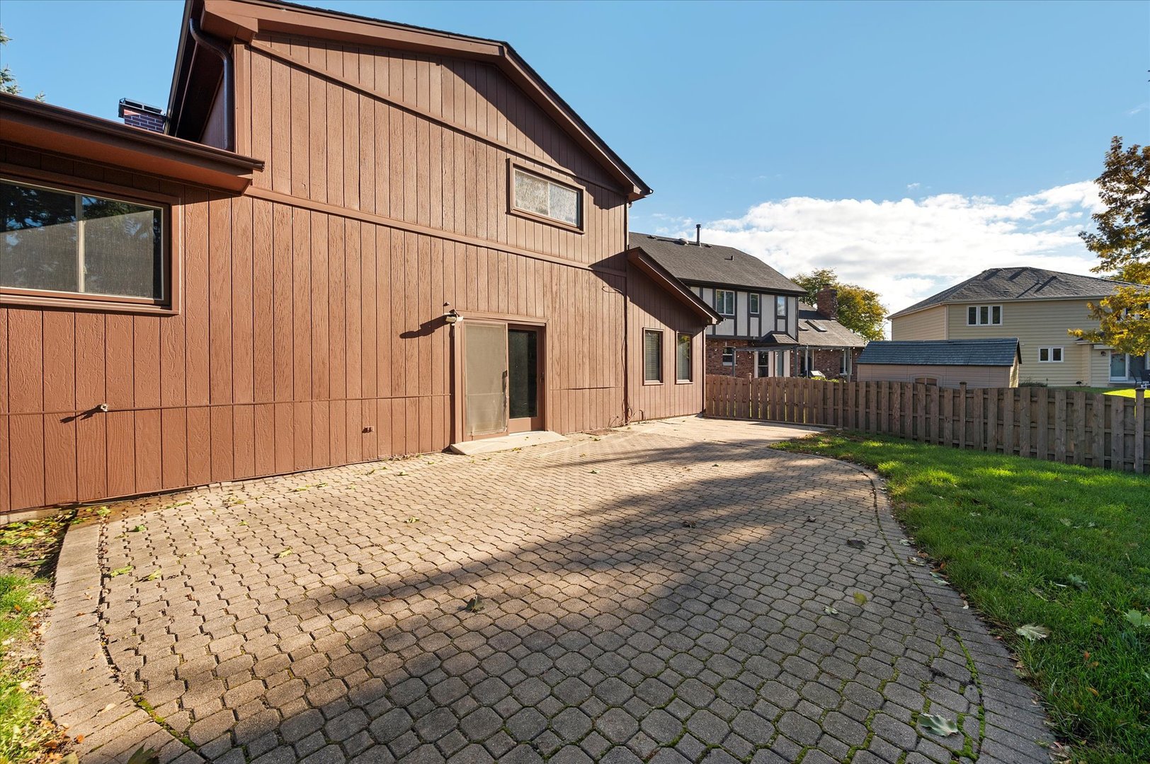 1228 Honey Hill Road Addison, IL 60101 - Photo 35 of 41 a backyard of a house with wooden fence