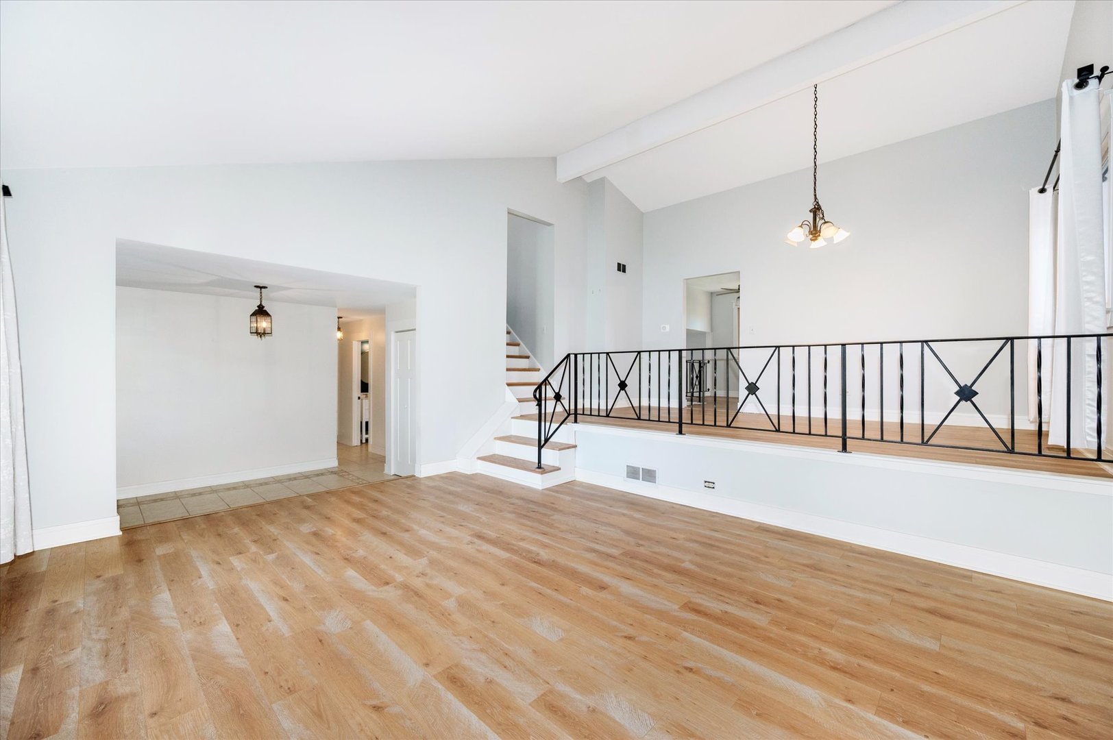 1228 Honey Hill Road Addison, IL 60101 - Photo 8 of 41 a view of a room with wooden floor and windows