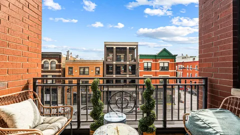 a view of a balcony with chairs
