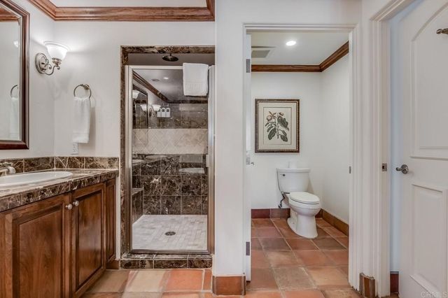 a bathroom with a toilet sink and shower