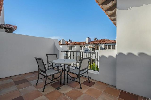 a view of balcony with furniture