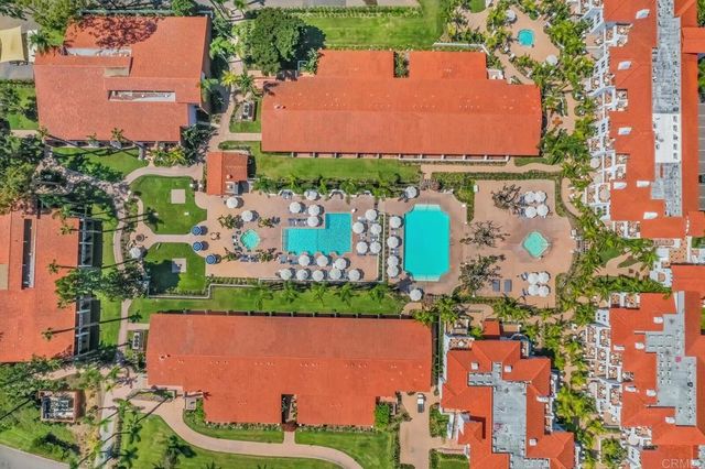 an aerial view of a house with a garden and outdoor space