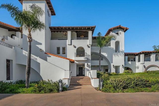 front view of a house with a potted plant