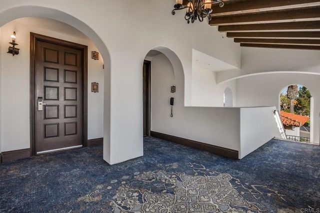 a view of a room that has a lot of windows