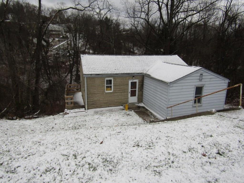 247 Conson Road Pittsburgh, PA 15227 - Photo 2 of 27 a view of a backyard with a large tree