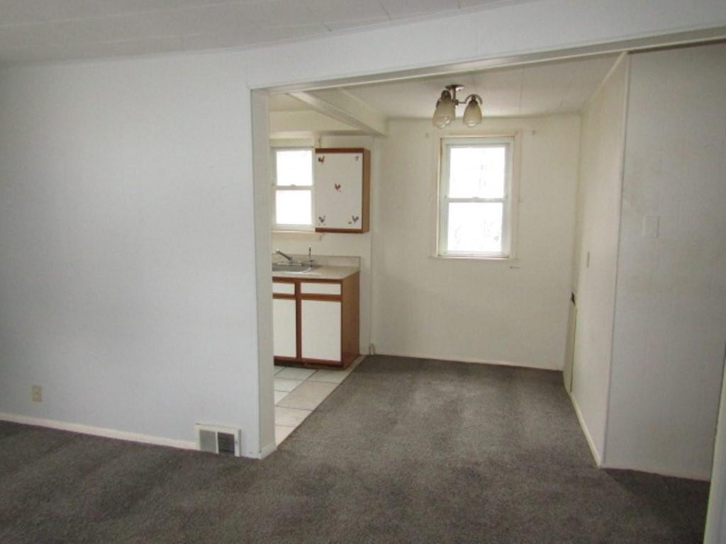 247 Conson Road Pittsburgh, PA 15227 - Photo 5 of 27 a view of an empty room with a window