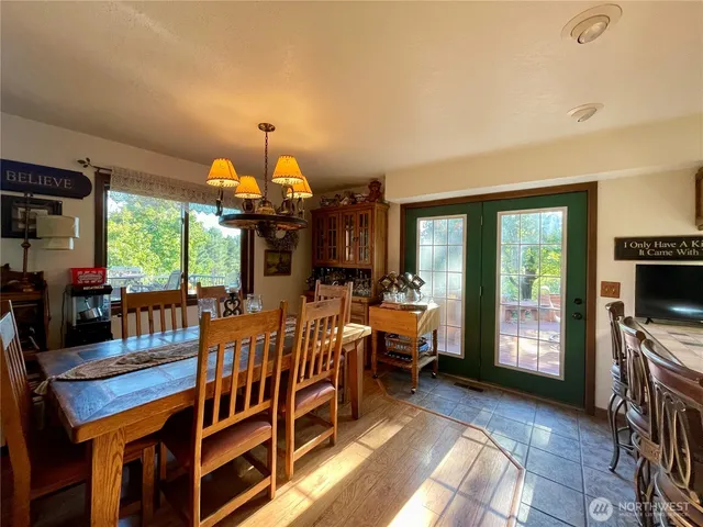 a very nice looking living room with a large window and a fireplace