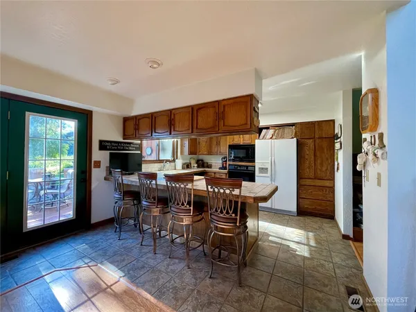 a view of a dining room with furniture window and outside view