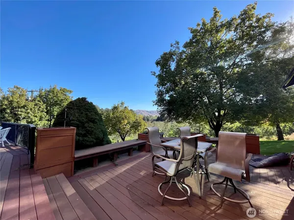 a view of a chairs and table in a patio