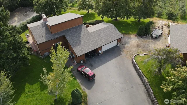 an aerial view of a house with a garden