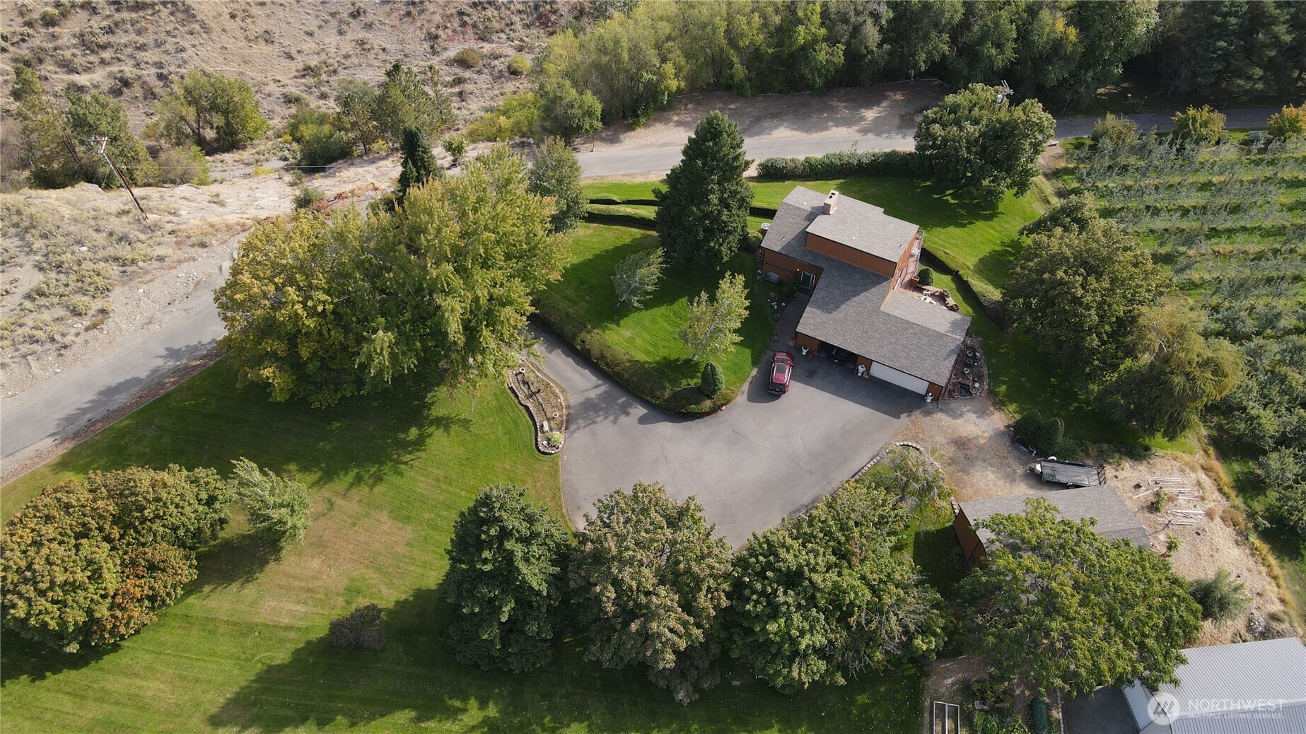 14 Hahn Road Omak, WA 98841 - Photo 28 of 38 an aerial view of a house with a yard lake lake and green space
