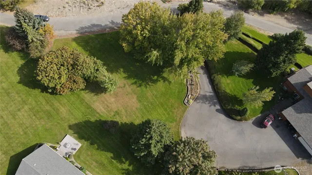 an aerial view of a residential houses with outdoor space
