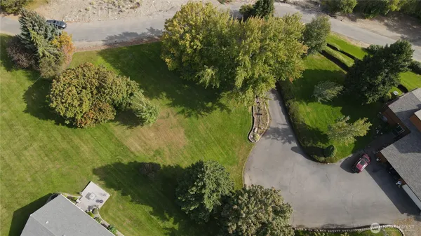 an aerial view of a residential houses with outdoor space