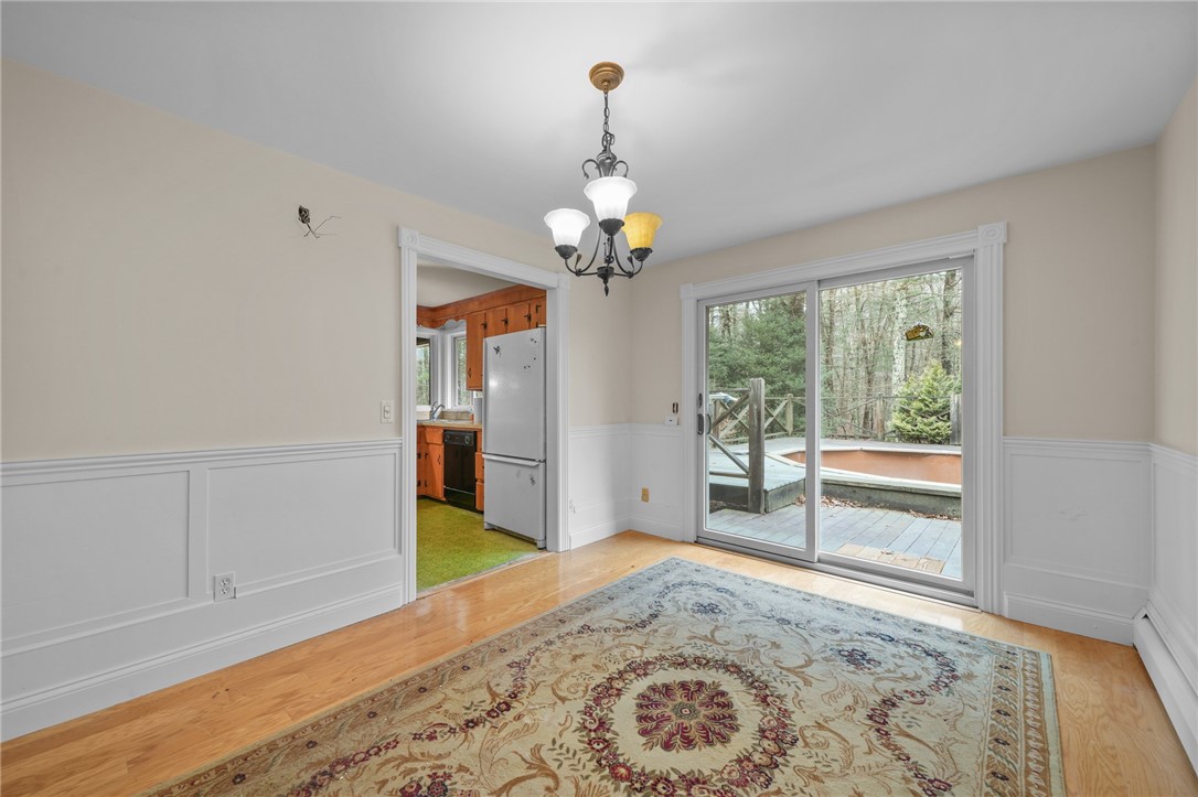 30 Sheffield Hill Road Exeter, RI 02822 - Photo 11 of 42 Dining room, looking toward kitchen and deck